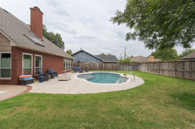 view of swimming pool featuring a lawn, an outdoor living space, and a patio