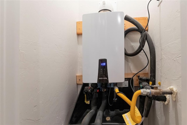 utility room with tankless water heater