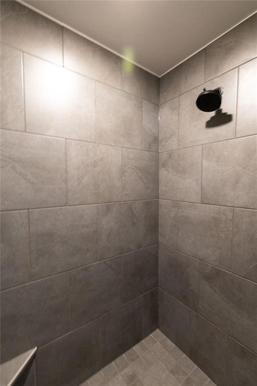 bathroom with tiled shower