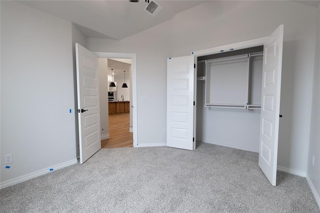 unfurnished bedroom with carpet flooring, visible vents, and baseboards