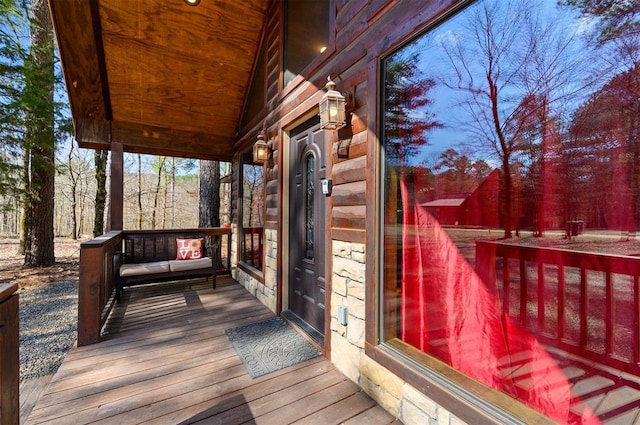 wooden terrace featuring a porch