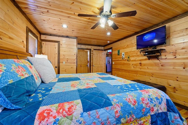 bedroom with ceiling fan, wooden walls, and wood ceiling