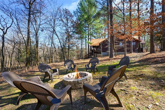 view of yard with a fire pit