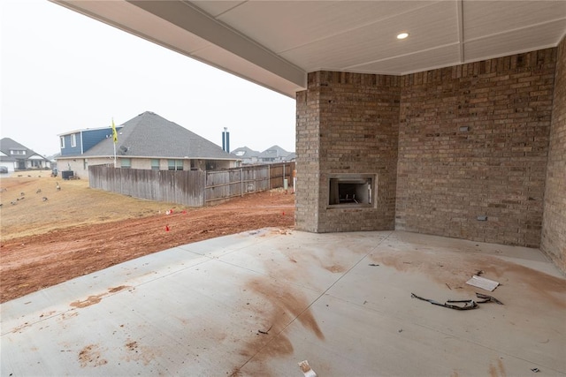 view of patio / terrace with an outdoor brick fireplace