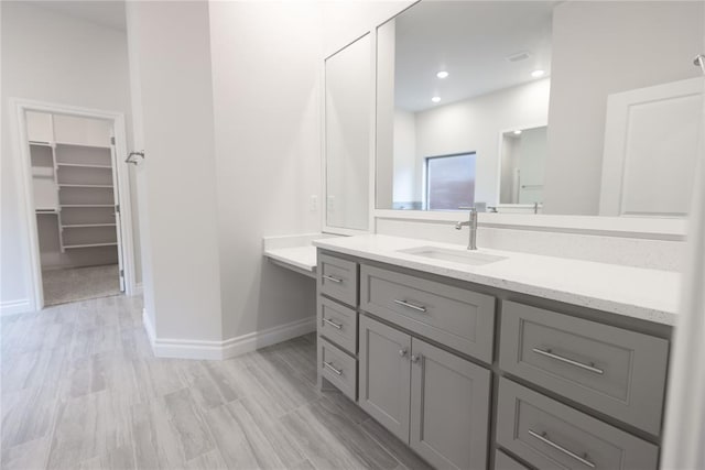 bathroom featuring vanity and hardwood / wood-style floors