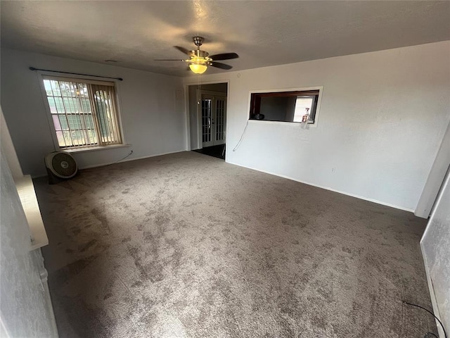 carpeted empty room with ceiling fan