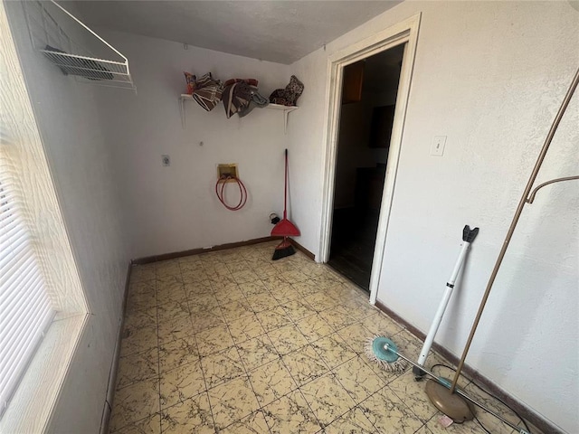 washroom with electric dryer hookup and hookup for a washing machine