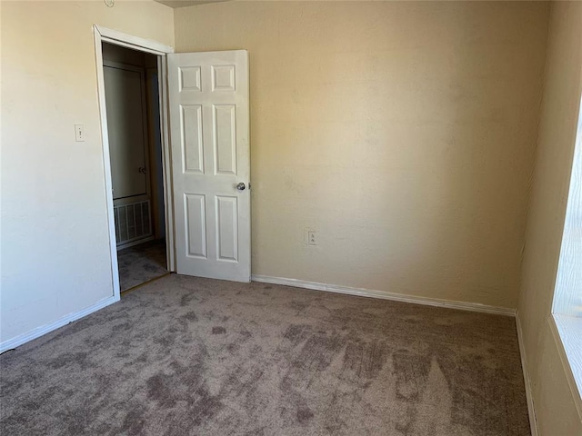 view of carpeted spare room