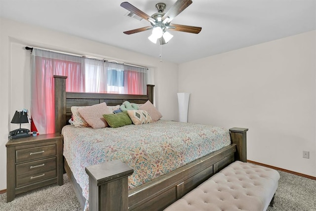 bedroom with ceiling fan and light colored carpet