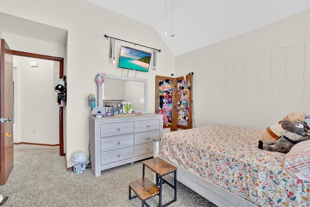 bedroom with light carpet and lofted ceiling