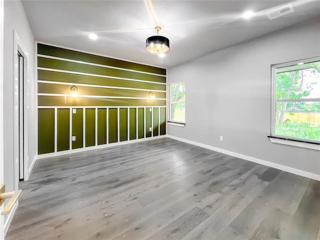 empty room with hardwood / wood-style flooring