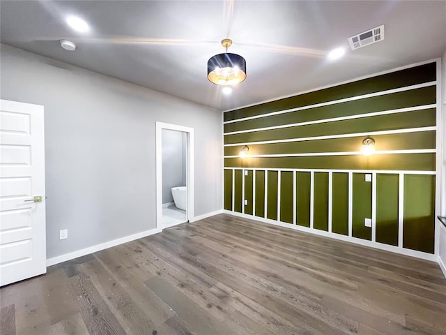 empty room with hardwood / wood-style floors