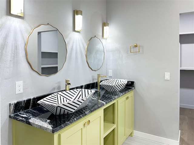 bathroom with hardwood / wood-style floors and vanity