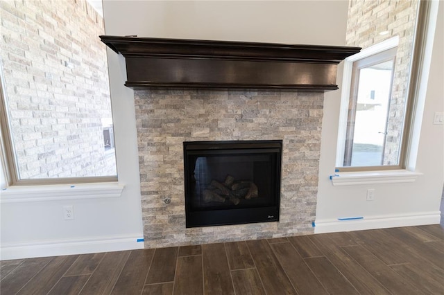 interior details with a stone fireplace