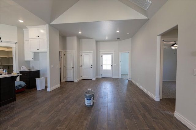 foyer featuring lofted ceiling, ceiling fan, and dark hardwood / wood-style floors