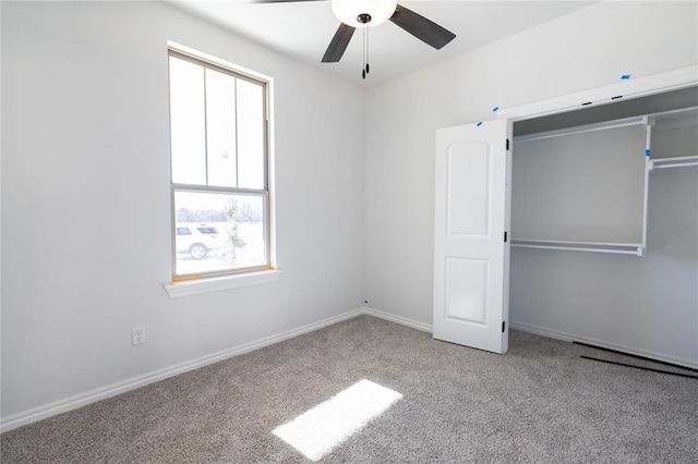 unfurnished bedroom featuring ceiling fan and light colored carpet