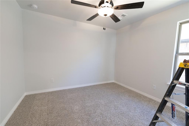 unfurnished room with ceiling fan and carpet flooring