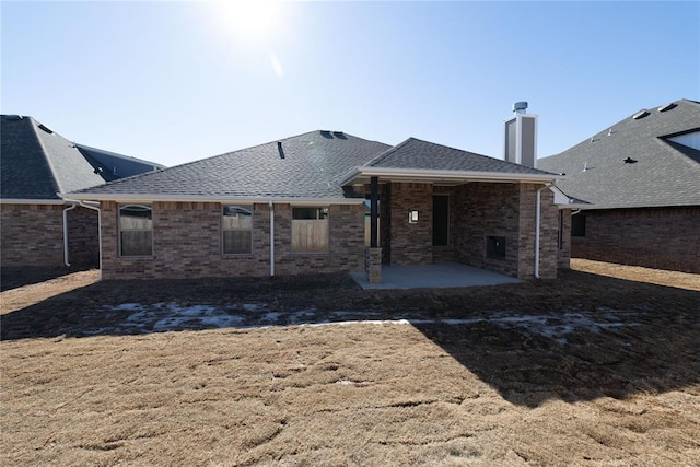 back of house with a patio area