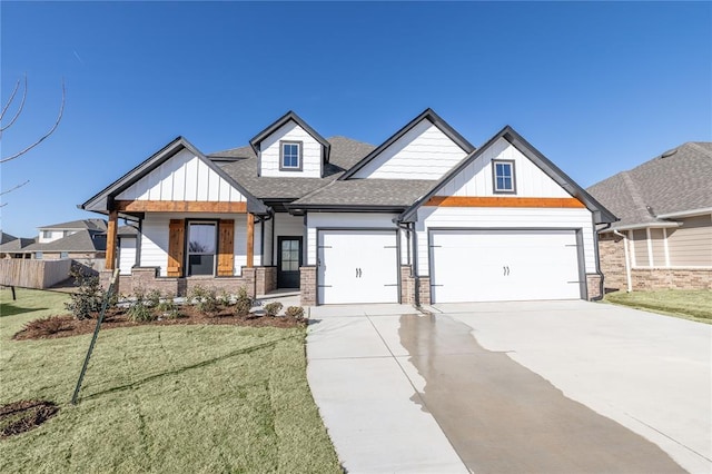 view of front of home featuring a garage, brick siding, concrete driveway, a front lawn, and board and batten siding