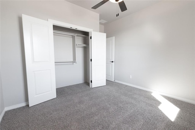 unfurnished bedroom with a closet, carpet flooring, and baseboards