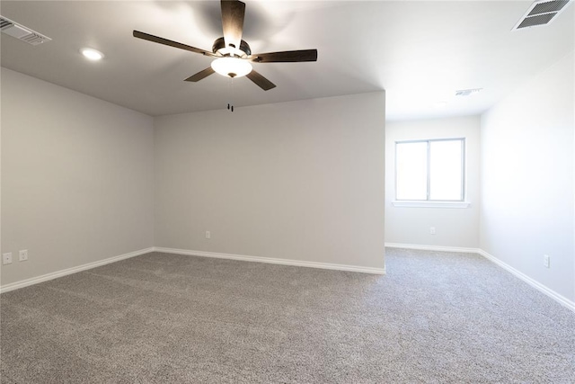 carpeted empty room featuring baseboards, visible vents, a ceiling fan, and recessed lighting