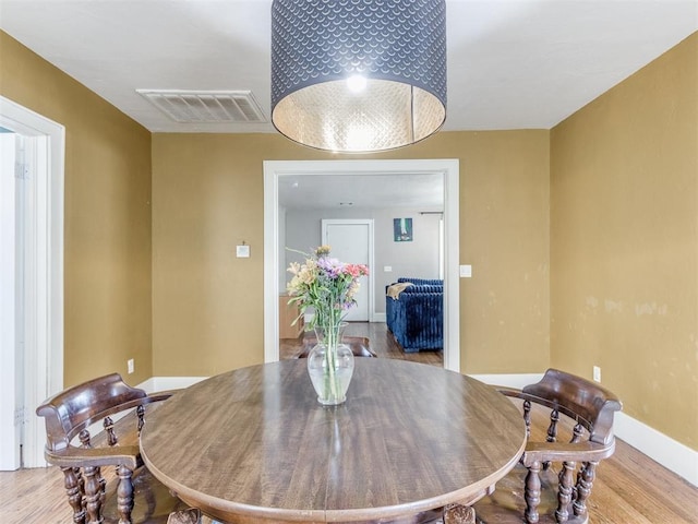 dining area with light wood-type flooring