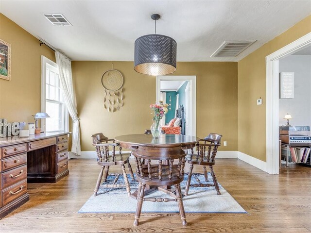 2045 NW 21st St, Oklahoma City, OK 73106 - dining space with light wood-style floors and baseboards
