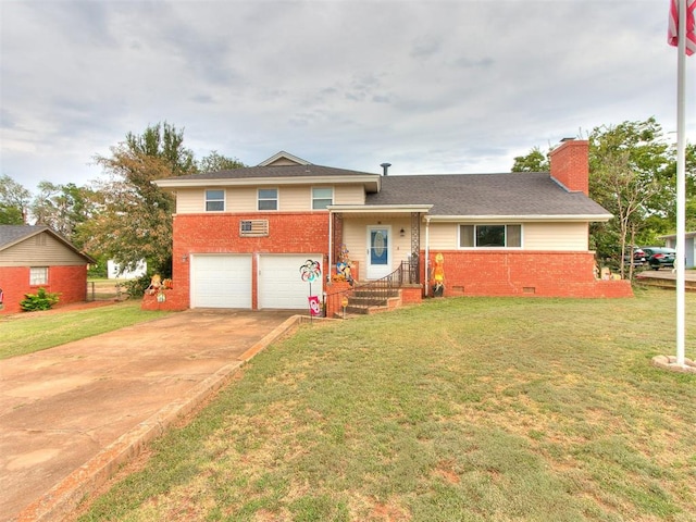 split level home with a front yard and a garage