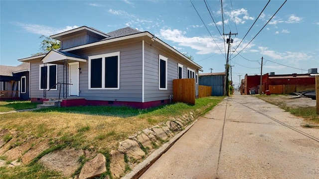 view of property exterior with a yard