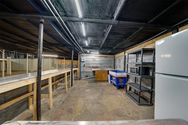 basement featuring white refrigerator