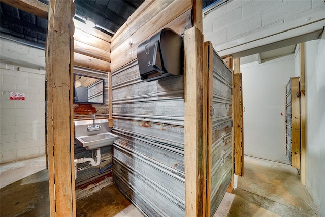 interior space with sink and concrete floors