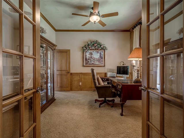 home office with light carpet, french doors, ceiling fan, and crown molding