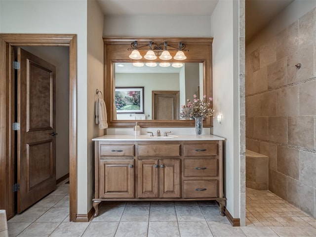 bathroom featuring a shower, vanity, and tile patterned flooring