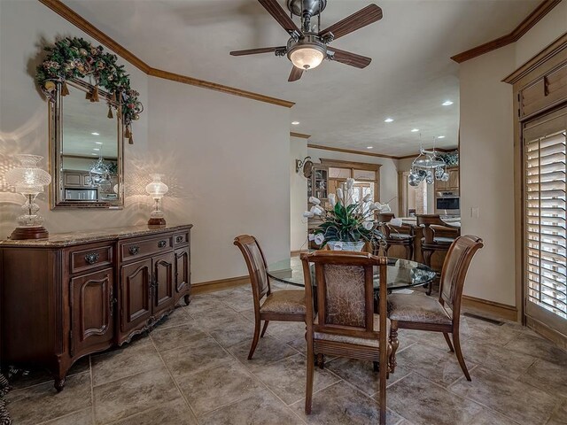 dining room with ceiling fan and ornamental molding