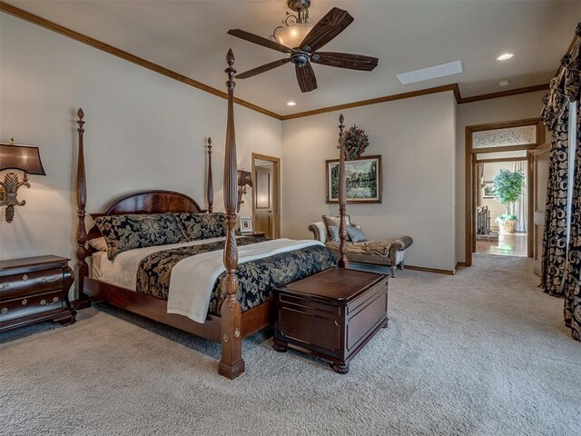 carpeted bedroom featuring ceiling fan and crown molding