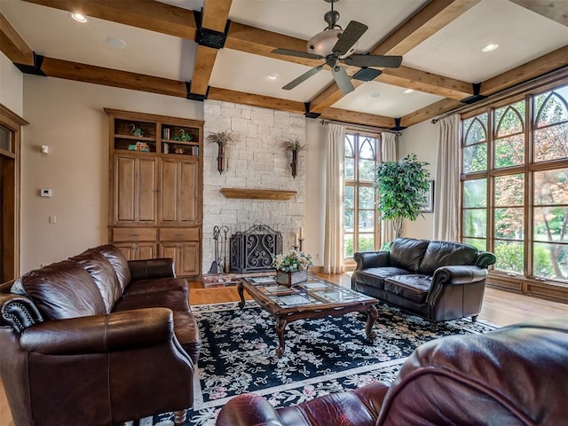 living room featuring a wealth of natural light and hardwood / wood-style flooring