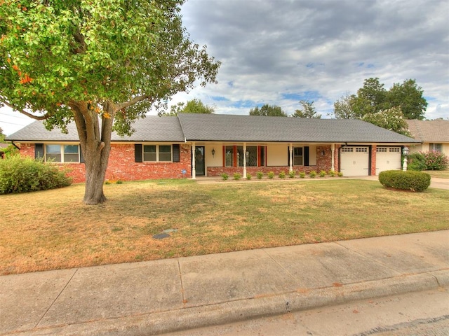 ranch-style house featuring a garage and a front yard