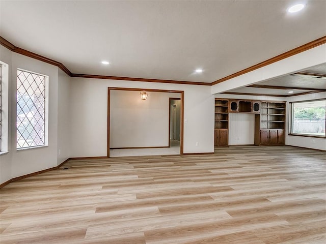 unfurnished living room featuring crown molding and light wood-type flooring