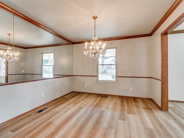 4997 NW 30th Pl, Oklahoma City, OK 73122 - empty room featuring a chandelier, wood finished floors, ornamental molding, and baseboards