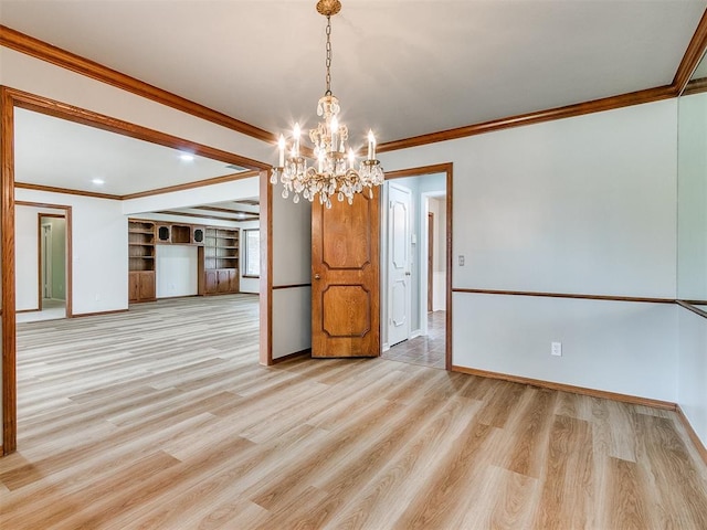 interior space featuring light wood-type flooring, an inviting chandelier, and crown molding