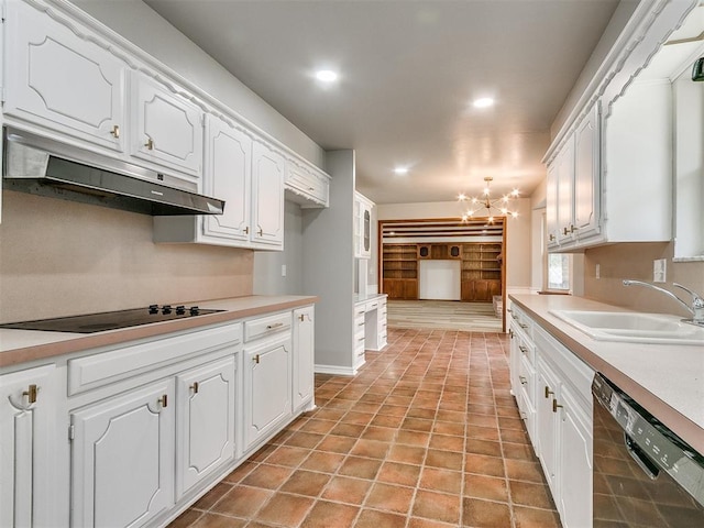 4997 NW 30th Pl, Oklahoma City, OK 73122 - kitchen with black appliances, under cabinet range hood, a sink, a chandelier, and white cabinets