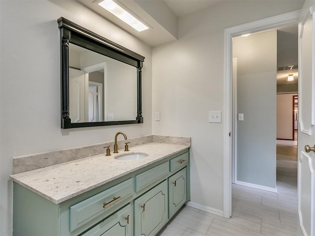 4997 NW 30th Pl, Oklahoma City, OK 73122 - bathroom with vanity, baseboards, and tile patterned floors