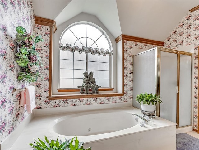 bathroom with shower with separate bathtub and vaulted ceiling