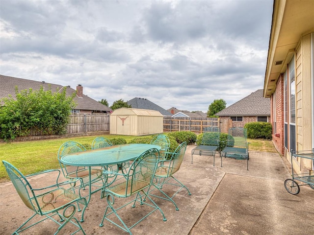 view of patio / terrace with a shed