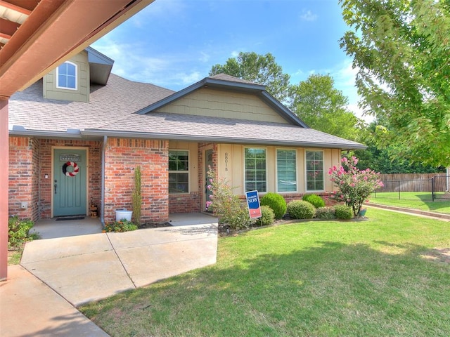 view of front of home with a front yard