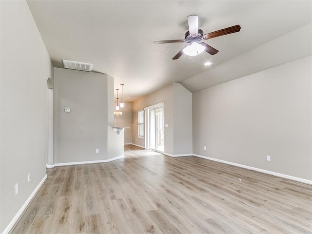 unfurnished living room with light wood-type flooring and ceiling fan