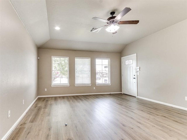 unfurnished room featuring ceiling fan, light hardwood / wood-style floors, and lofted ceiling