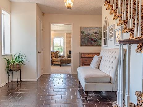 sitting room with a textured ceiling