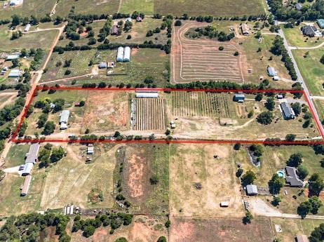 birds eye view of property featuring a rural view