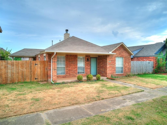 ranch-style home with a front yard